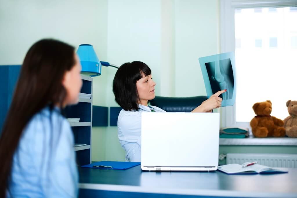 young-woman-doctor-watching-x-ray